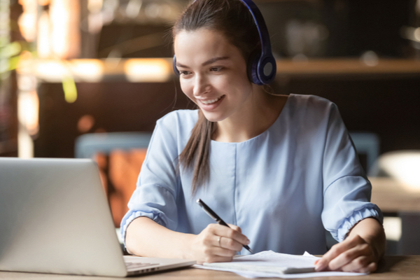 Female With Headset Studying Online